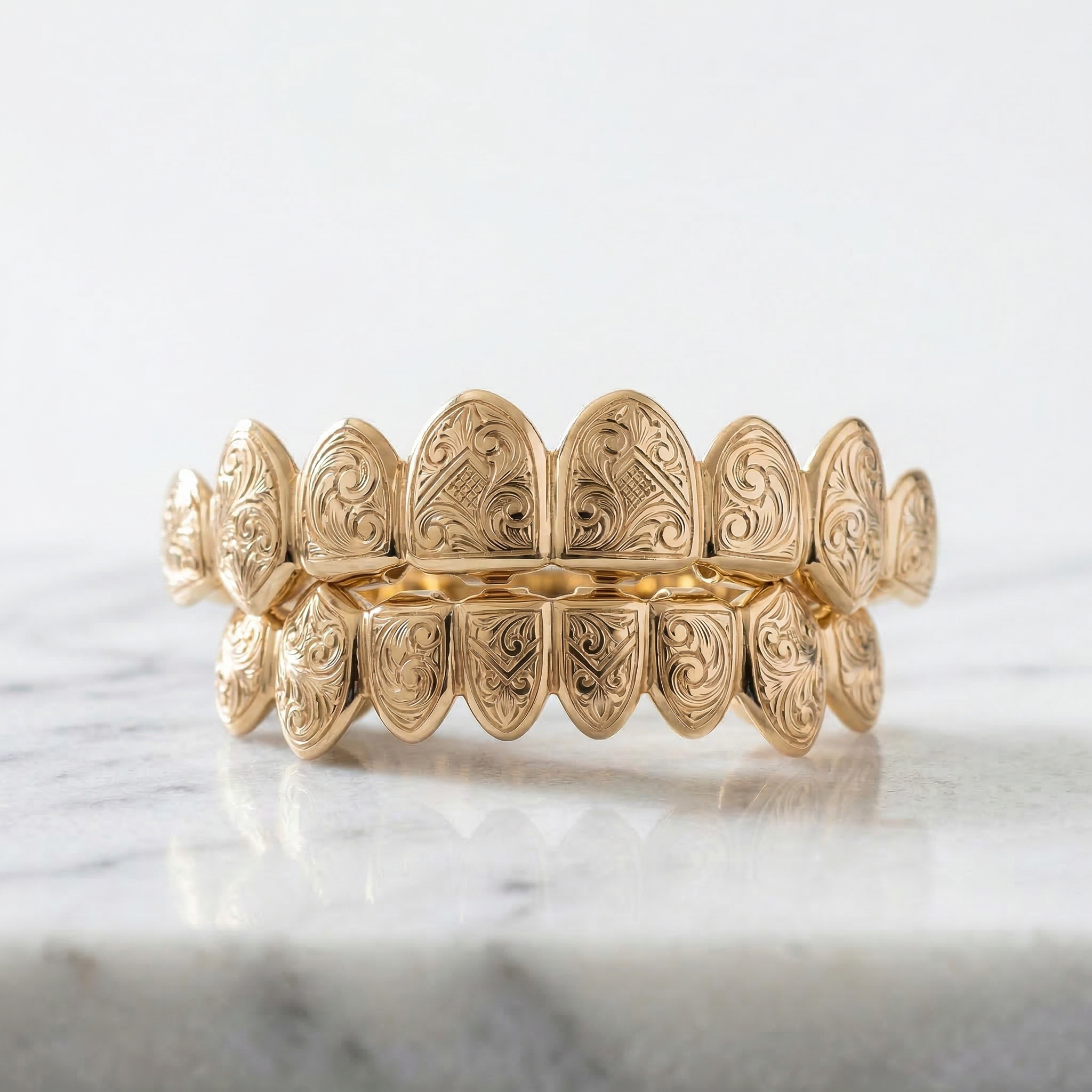 Engraved Grillz Featuring a Gold Bar in the Back