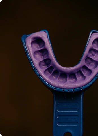 Step 4: Center the tray on your teeth, press gently (don’t bite), let it set, then pull it straight off.